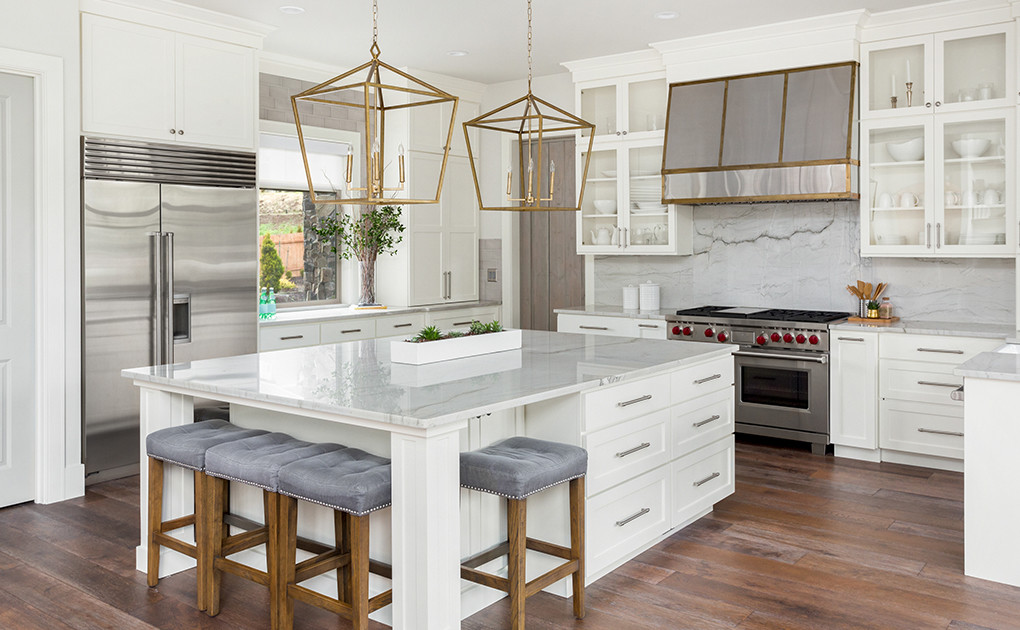 Luxury kitchen in white with marble and gold accents